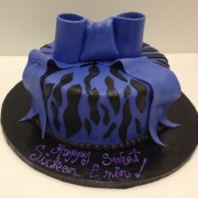Sweet 16 with A Zebra Print and Oversized Purple Bow.Purple Teenager Fondant Icing.