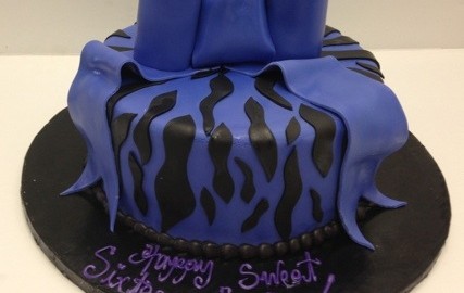 Sweet 16 with A Zebra Print and Oversized Purple Bow.Purple Teenager Fondant Icing.