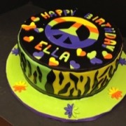Peace ,Love And Cake Is The Motto At Millers,Tie Dye With A Funky Animal Print On The Sides.Cool Cake For Your Teenager ,That Is Driving You Crazy ,But You Still Love.