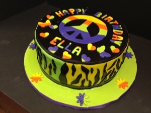 Peace ,Love And Cake Is The Motto At Millers,Tie Dye With A Funky Animal Print On The Sides.Cool Cake For Your Teenager ,That Is Driving You Crazy ,But You Still Love.